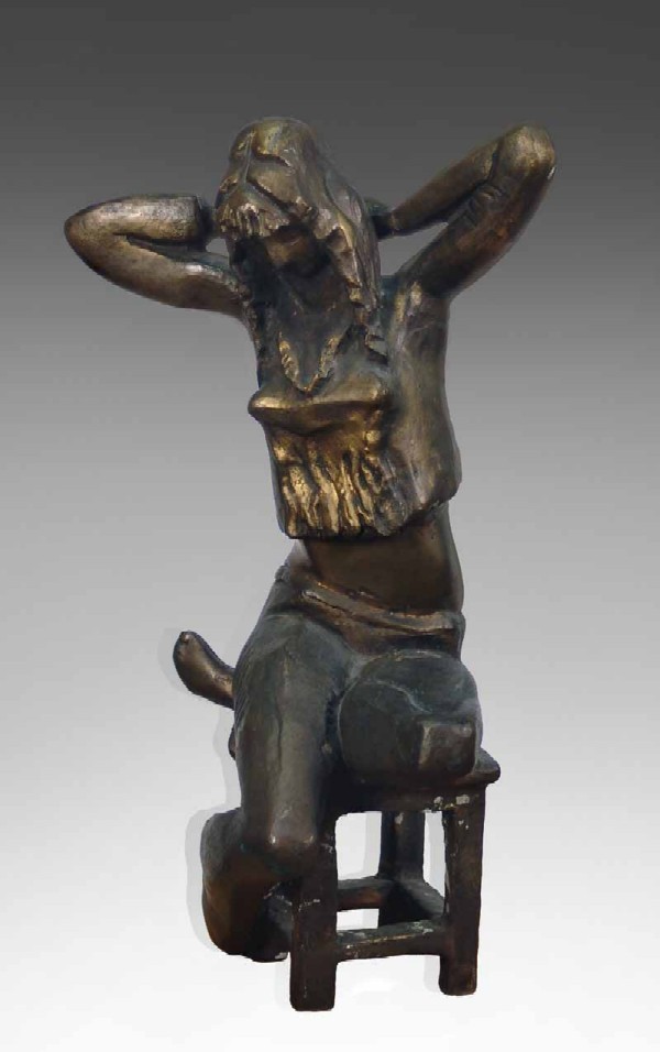 Girl sitting on a stool.