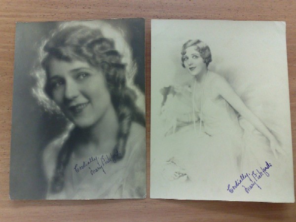 2 photos of Mary Pickford. With facsimiles of her autographs. Late 20s.