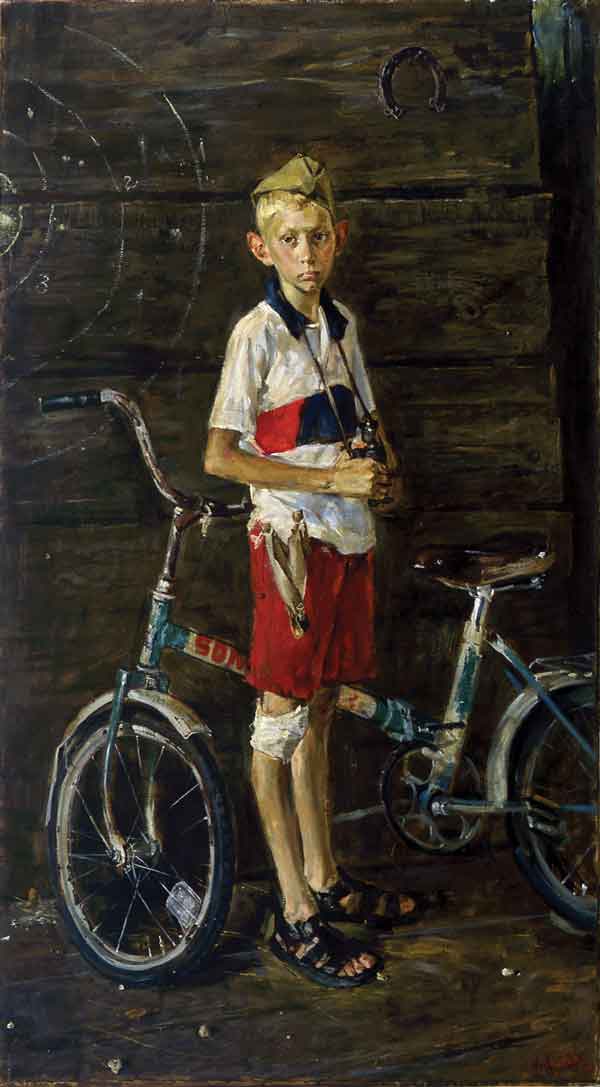 Boy with a bicycle.